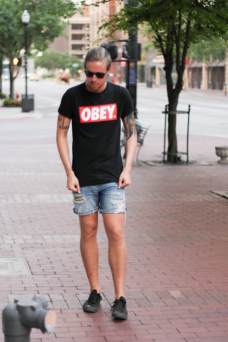 The Kentucky Gent in Obey T-Shirt, Levi's Cut Off Shorts, Converse Chuck Taylors, and Ray-Ban Liteforce Wayfarers.