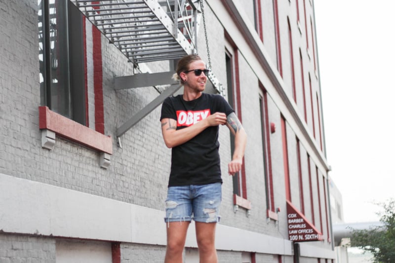 The Kentucky Gent in Obey T-Shirt, Levi's Cut Off Shorts, Converse Chuck Taylors, and Ray-Ban Liteforce Wayfarers.