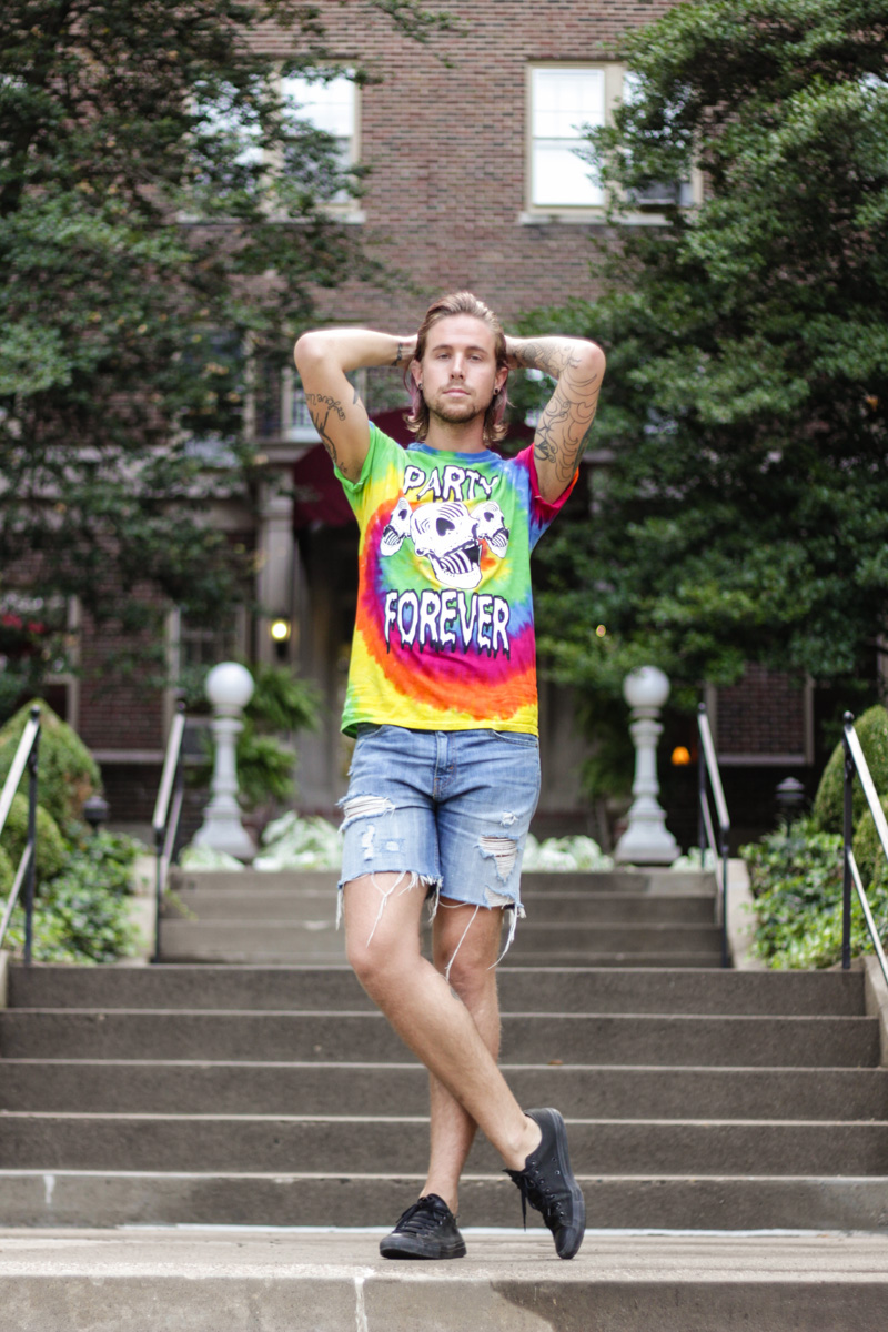 The Kentucky Gent in Chi Flo Apparel Party Forever Tie Dye T-Shirt, Levi's Cut Off Shorts, and Converse Chuck Taylors.