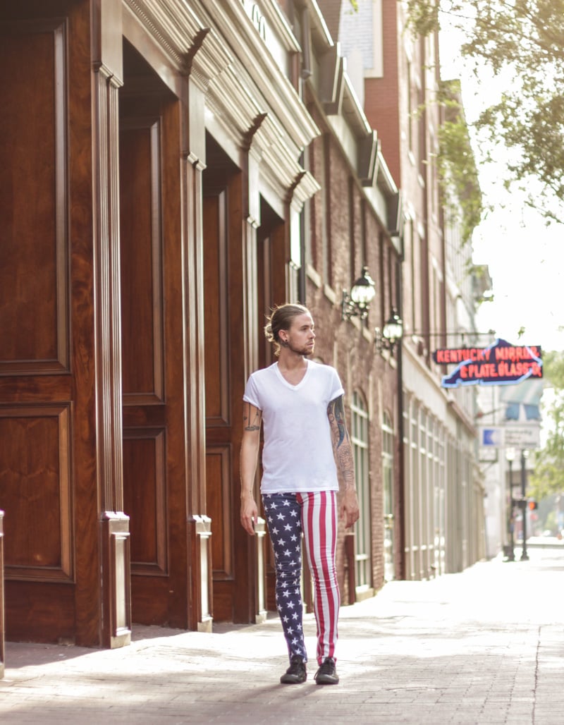The Kentucky Gent in Kill City American Flag Jeans, BDG V Neck Tee, and Converse Chuck Taylors.