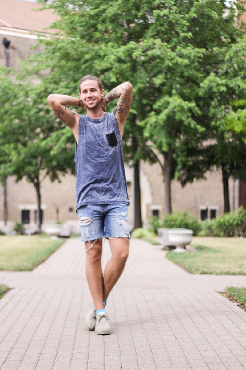 The Kentucky Gent in The Narrows Leather Pocket Tank Top, Levi's Cut Off Shorts, Richer Poorer Paradise Socks, and CAT Footwear Suede Chukka Boots.