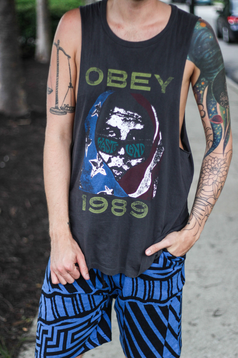 The Kentucky Gent in Obey Clothing Tank Top, Urban Outfitters Shorts, Converse Chuck Taylors, and Spy Optic Sunglasses.