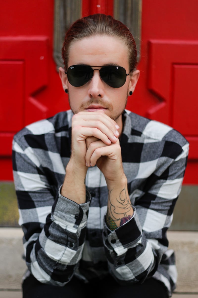 The Kentucky Gent, a men's life and style blogger, in Salt Valley Plaid Shirt, Ray-Ban Aviator Sunglasses from East Dane, Levi's 511 Skinny Jeans, and Converse Chuck Taylors. 