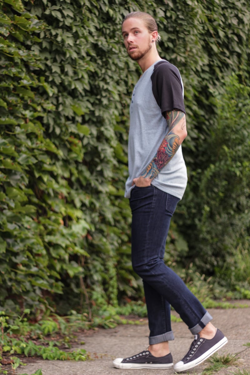 The Kentucky Gent, a men's  fashion and life style blogger, in BDG Baseball T-Shirt, Ambig Jeans, and Converse Chuck Taylors.