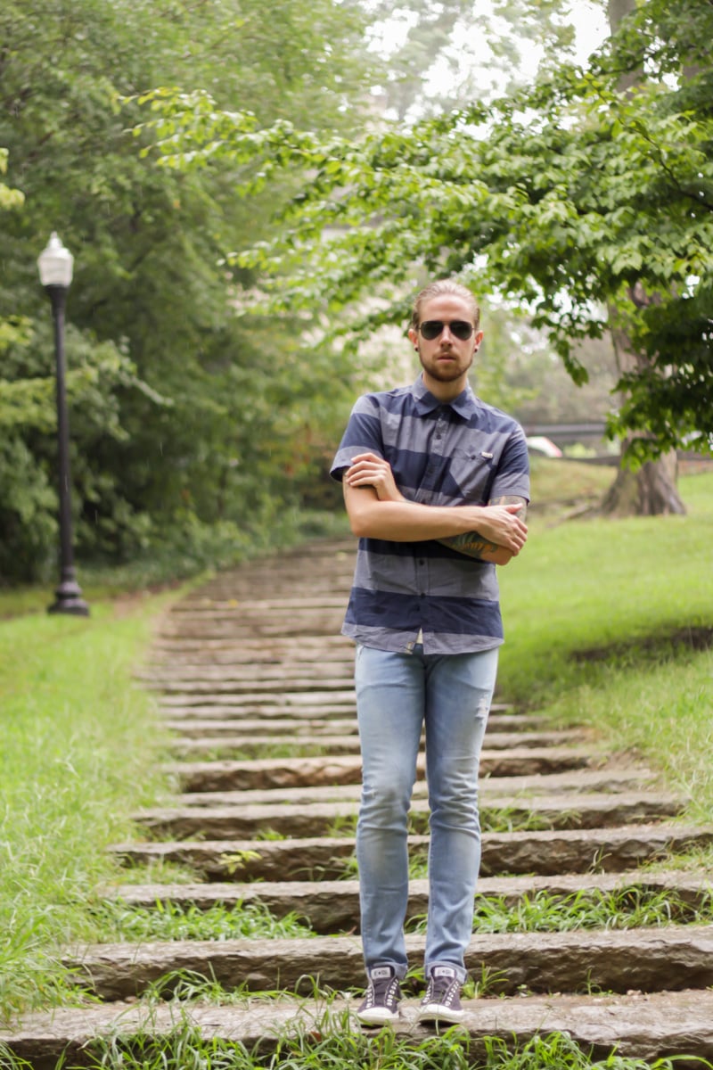 The Kentucky Gent, a men's fashion and life style blogger, in Ambig Striped Short Sleeve Button Up Shirt, H&M Light Wash Denim Jeans, Converse Chuck Taylors, and Ray-Ban Aviator Sunglasses from East Dane.