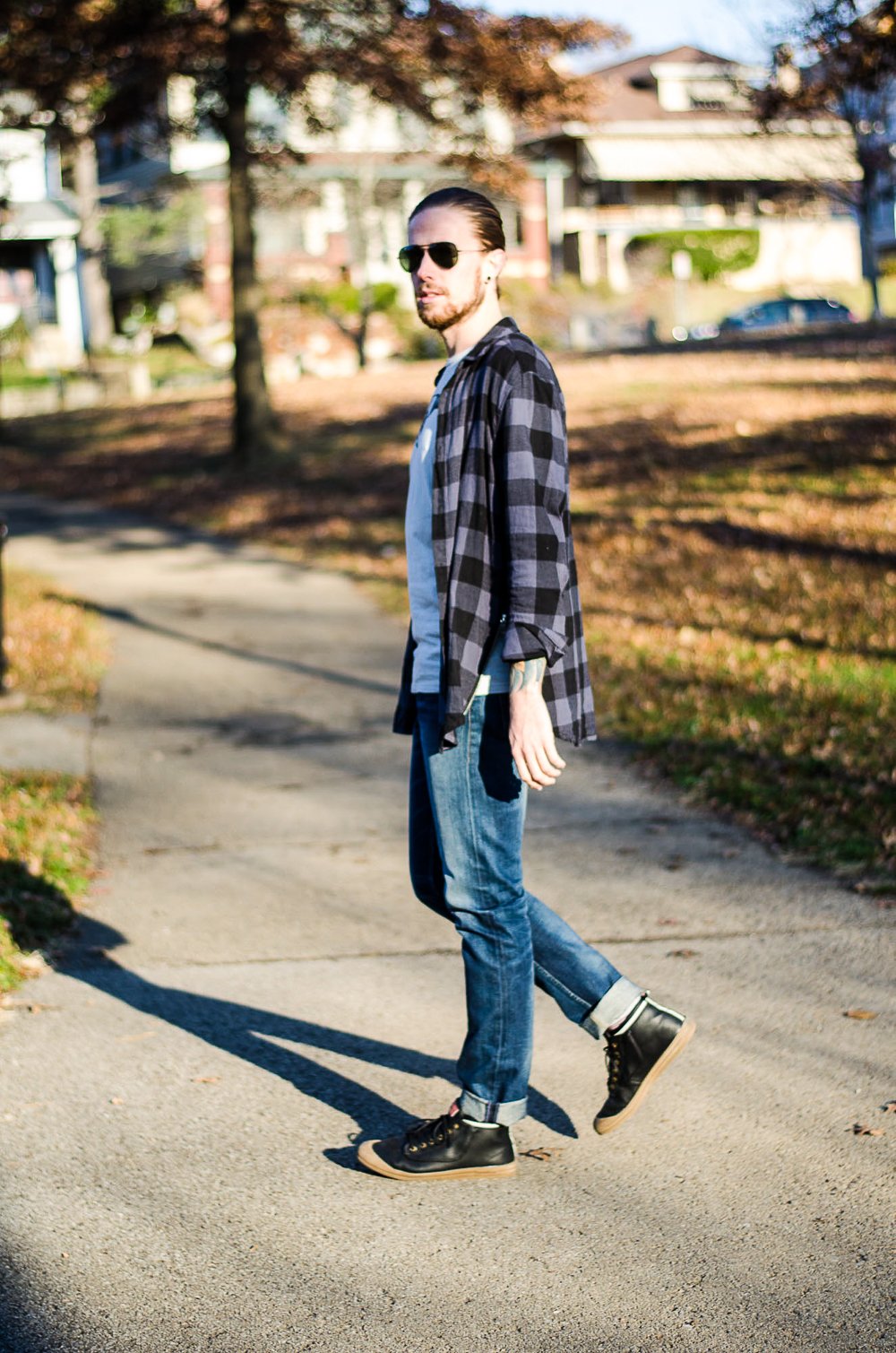The Kentucky Gent, a Louisville, Kentucky life and style blogger, in Y'allsome Kentucky Bourbon Tee, H&M Plaid Shirt, Levi's Made & Crafted Denim Pants, Richer Poorer Socks, Volley High Top Sneakers, and Ray-Ban Aviator Sunglasses. 