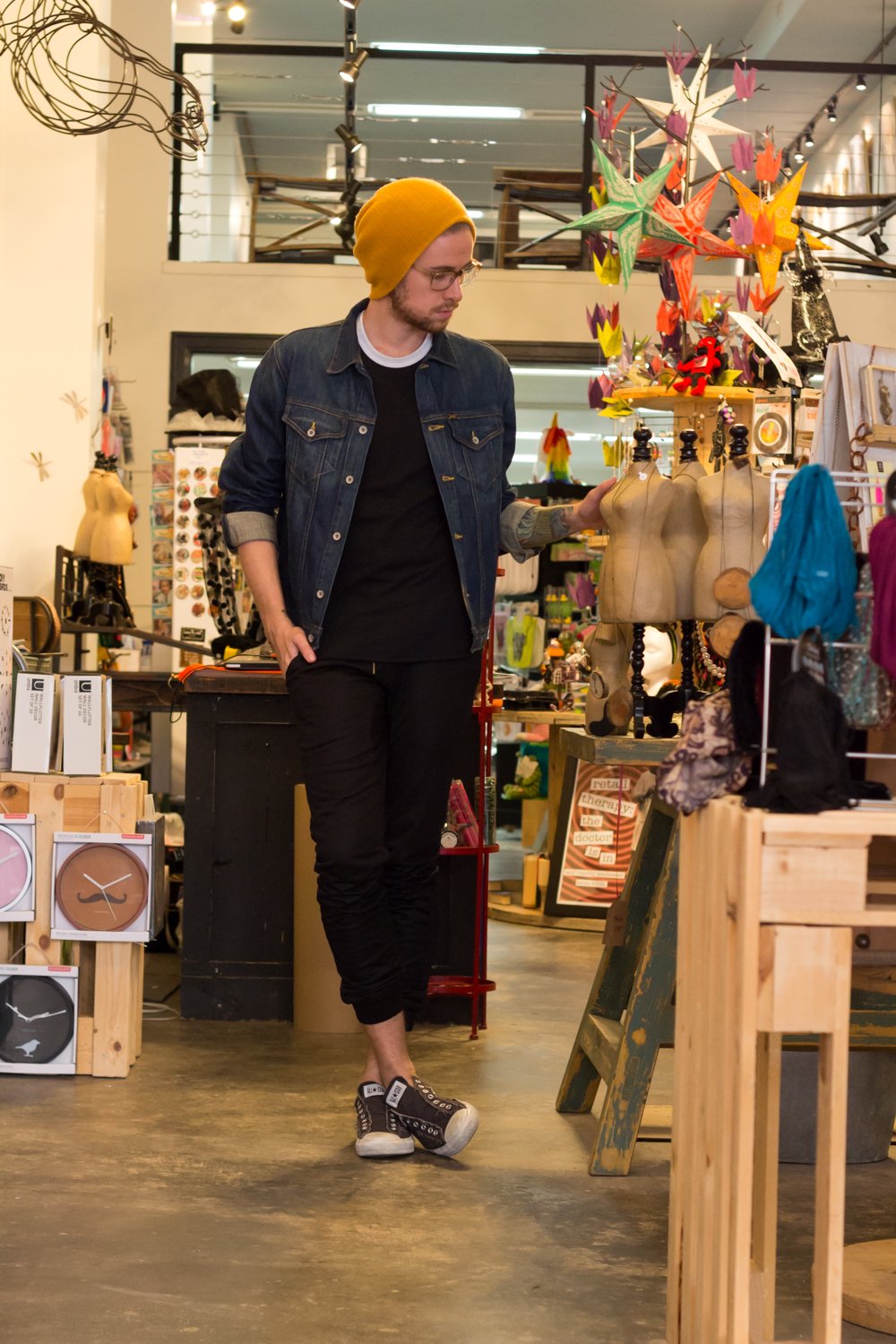 The Kentucky Gent, a Louisville, Kentucky blogger, in Forever 21 Beanie, Big Star Denim Jacket, American Apparel Baseball Tee, Zanerobe Mesh Joggers, and Converse Chuck Taylors at Regalo on South Fourth Street. 
