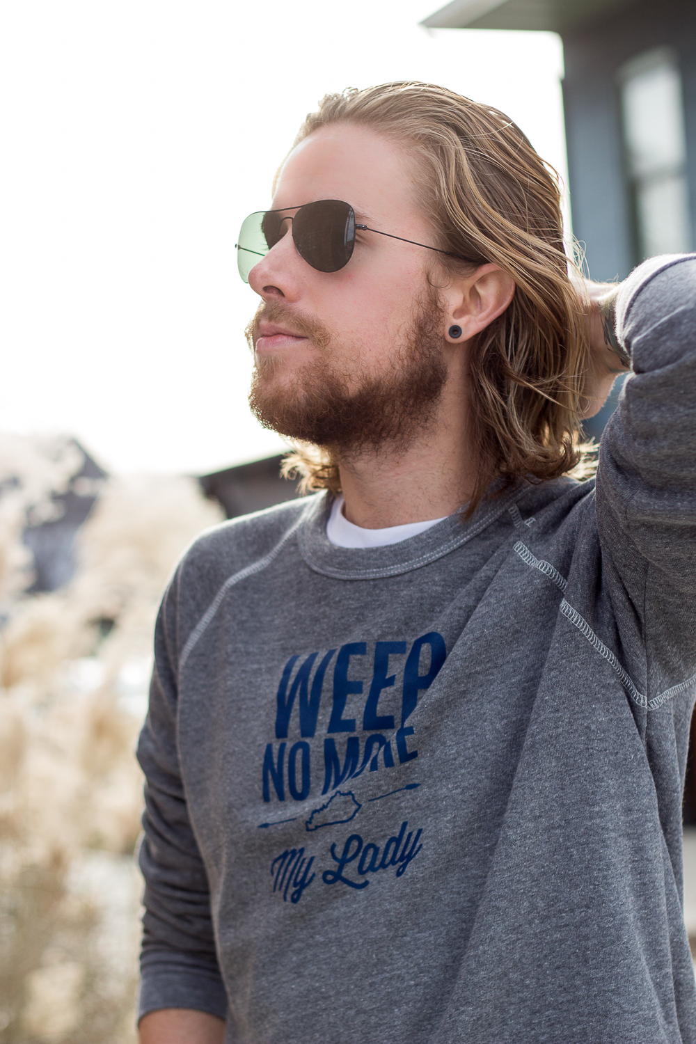 The Kentucky Gent, a Louisville, Kentucky men's life and style blogger, in Shop Local KY Weep No More My Lady Sweatshirt, Levi's Made and Crafted Denim, Converse Chuck Taylors, and Ray-Ban Aviator Sunglasses.