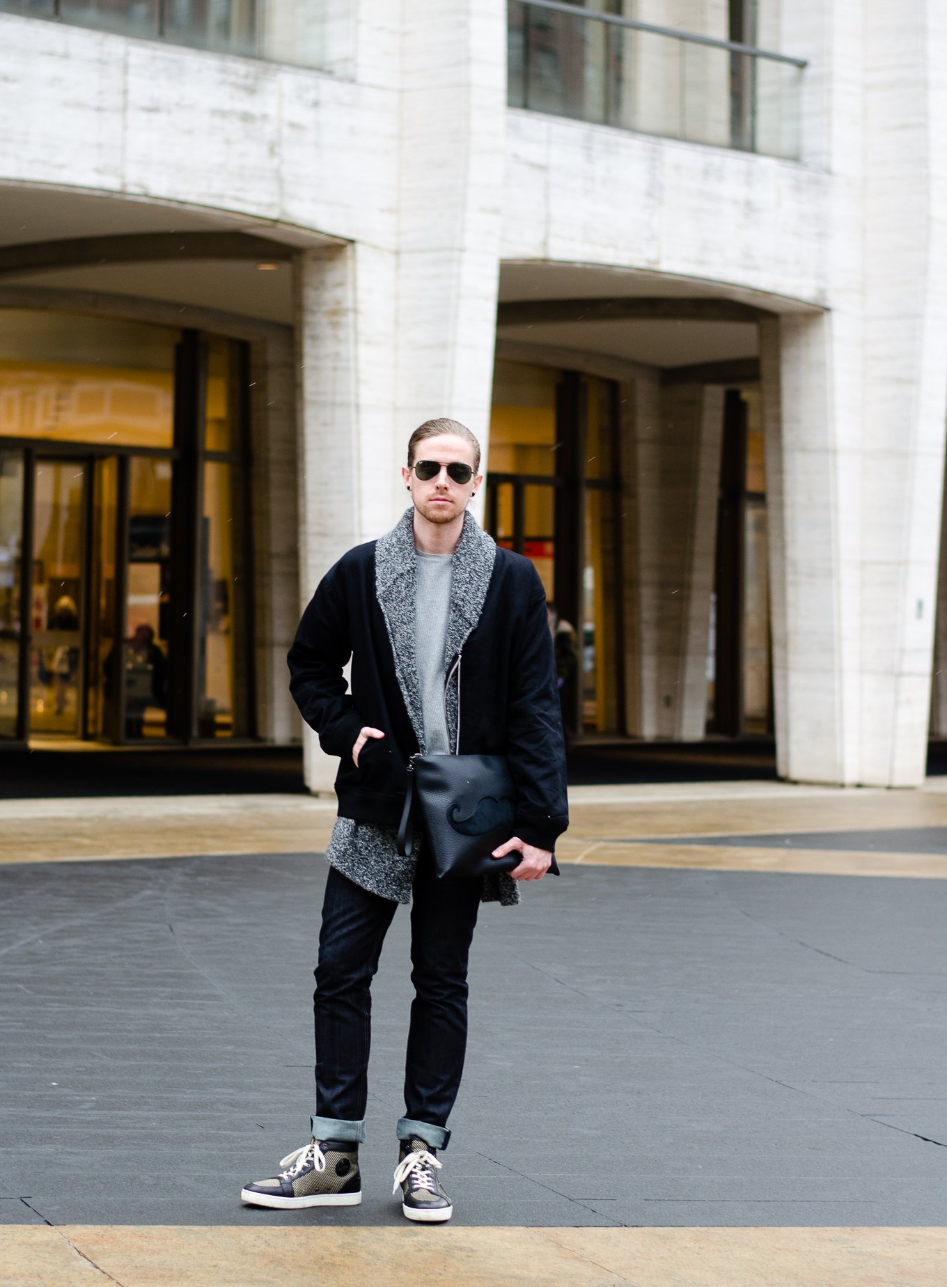 The Kentucky Gent, a men's fashion and lifestyle blogger, spends his first day of NYFW at Lincoln Center in Christian Louboutin sneakers and bag.The Kentucky Gent, a men's fashion and lifestyle blogger, spends his first day of NYFW at Lincoln Center in Christian Louboutin sneakers and bag.