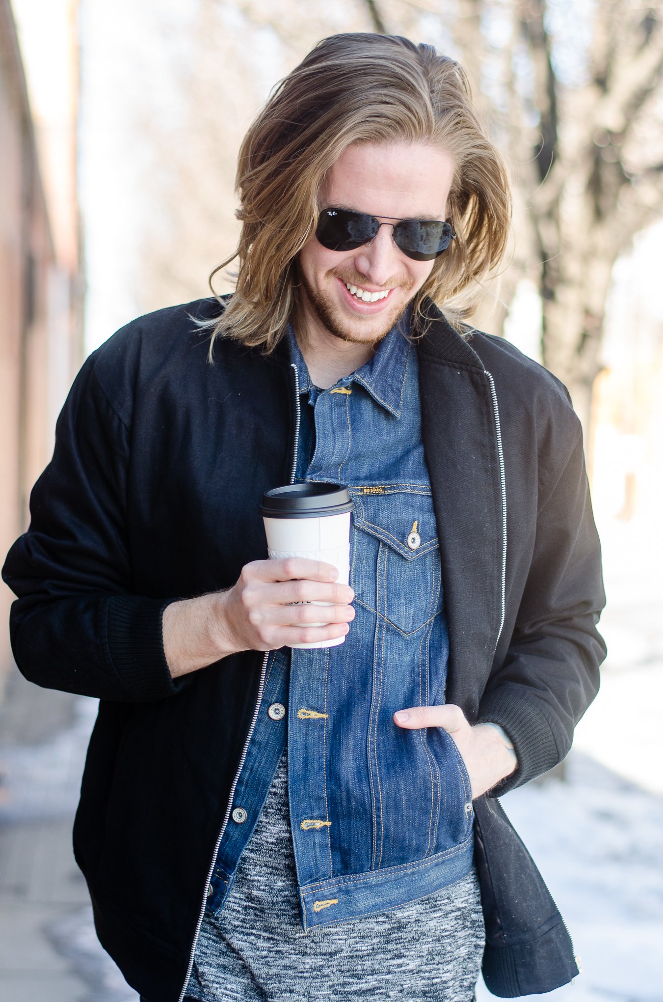 The Kentucky Gent, a men's fashion and lifestyle blogger, whips his hair back and forth. 